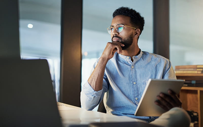Man in office looking at computer