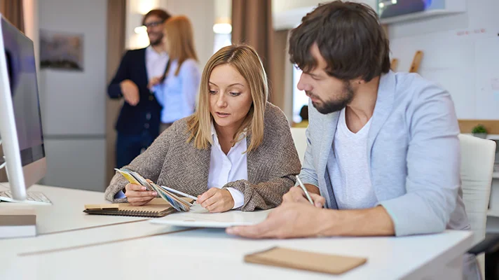 Two people in office