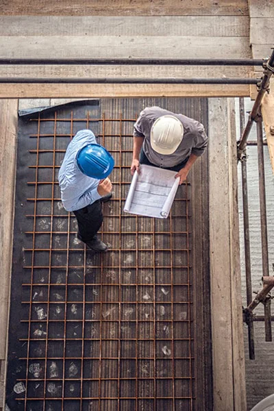 Two people working in new building construction